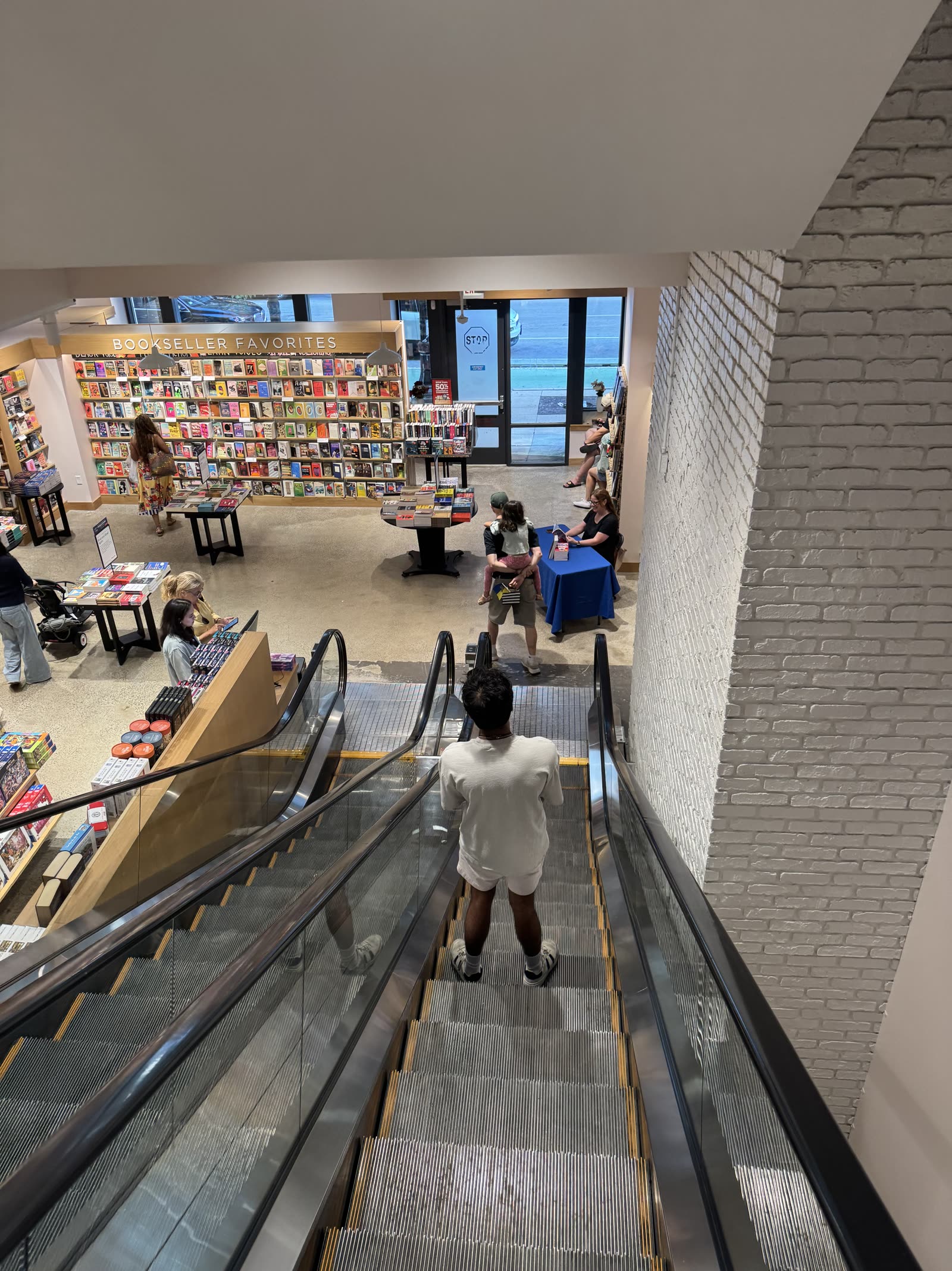 Escalator and Bookseller Favorites section inside the store