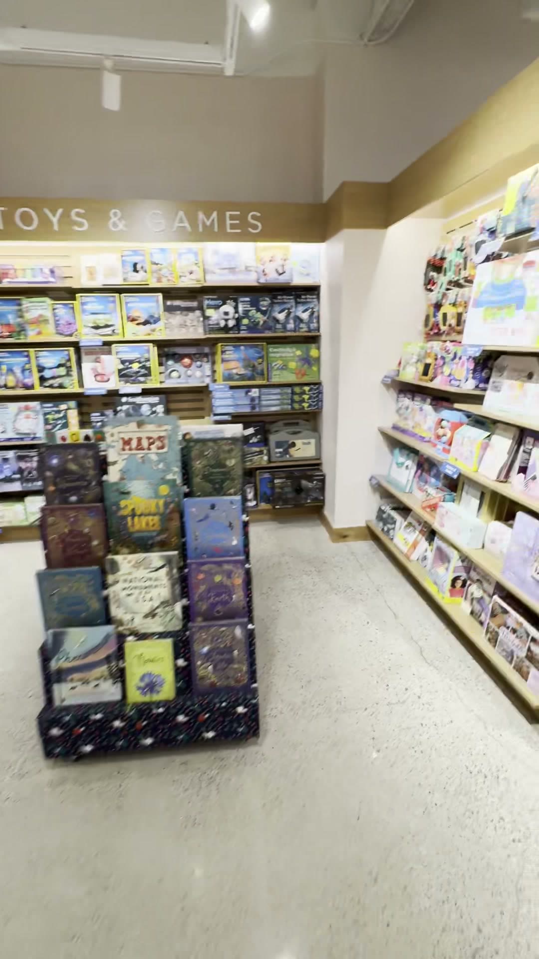Toys & Games section, maps and nature-themed kids books