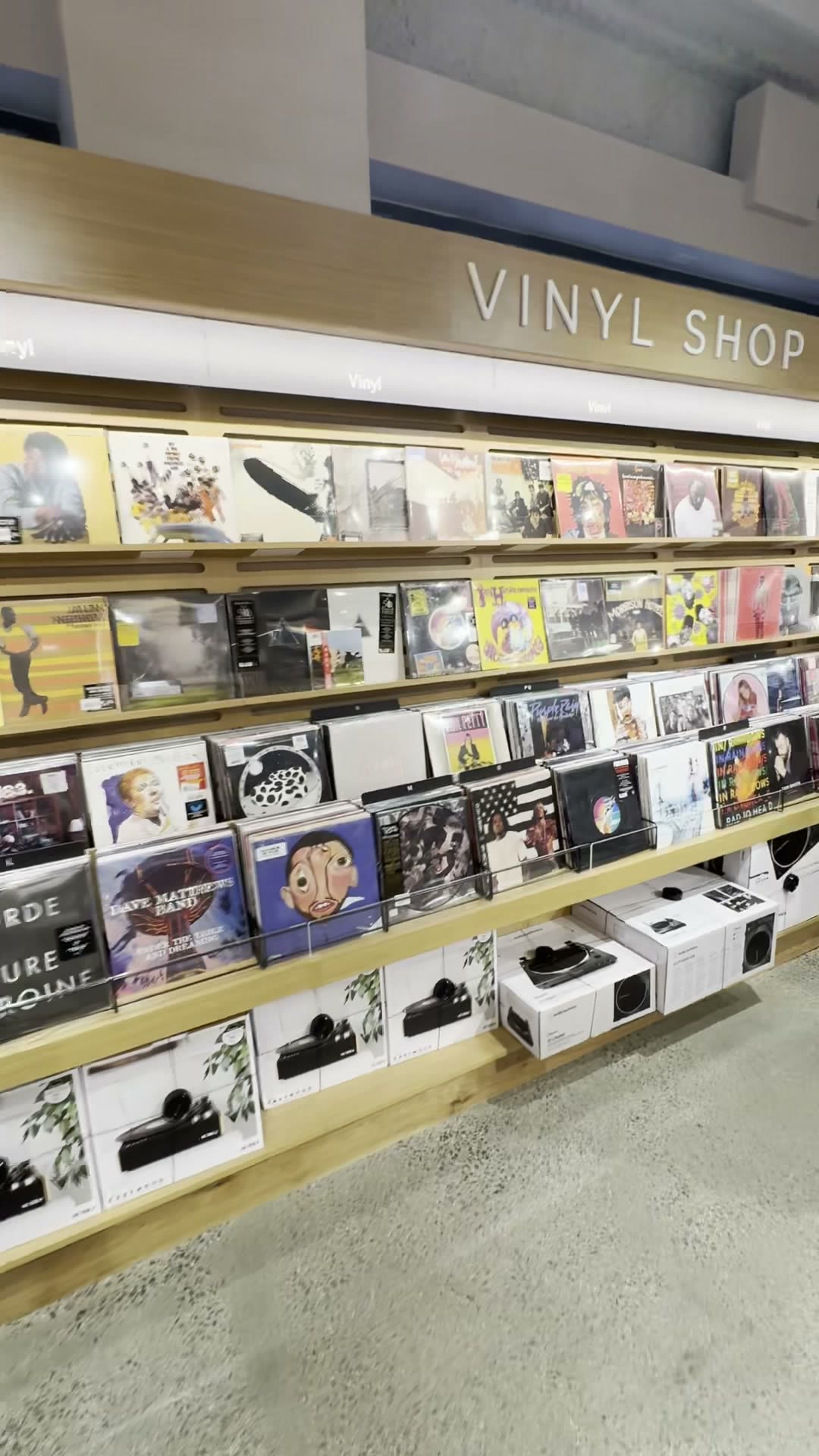 VINYL SHOP sign and record racks