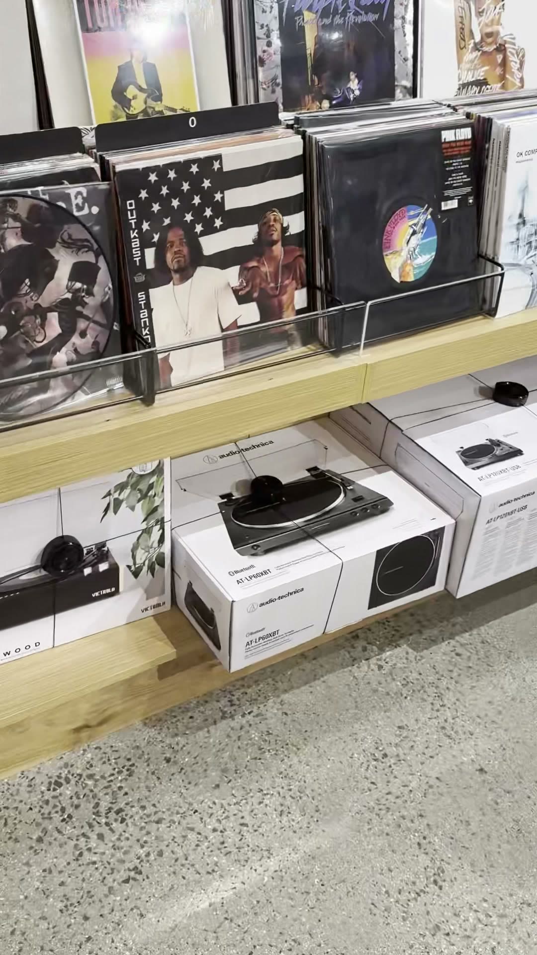 Vinyl records by Outkast, Pink Floyd, and others, plus Audio-Technica turntable boxes